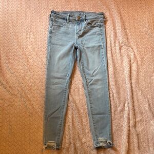 American Eagle Outfitters Blue Skinny Jeans with Distressed Hem